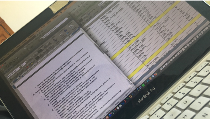 ajkwhdk A MacBook Pro screen displaying a document and a spreadsheet side by side.