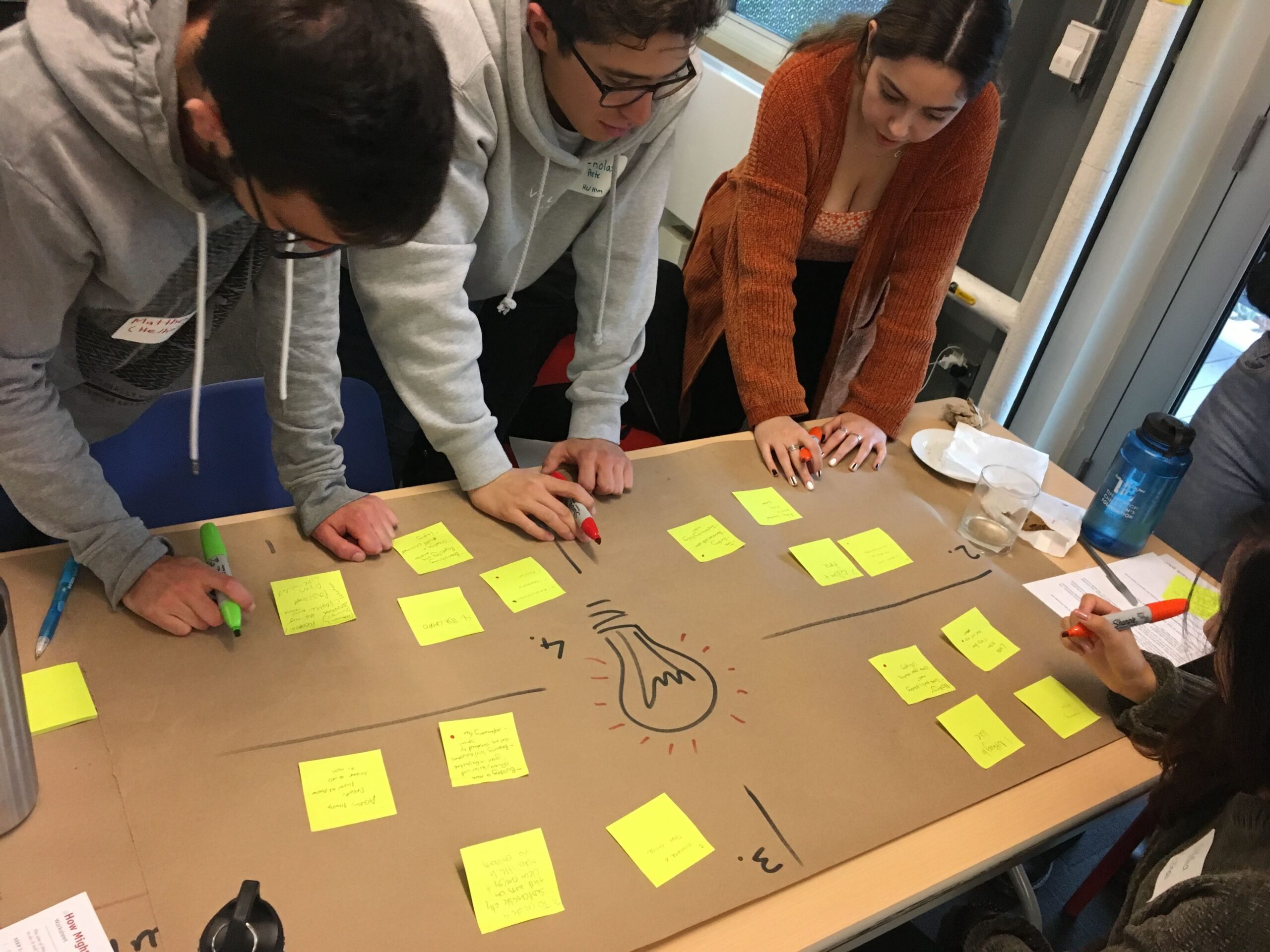 youth working on lightbulb paper 3